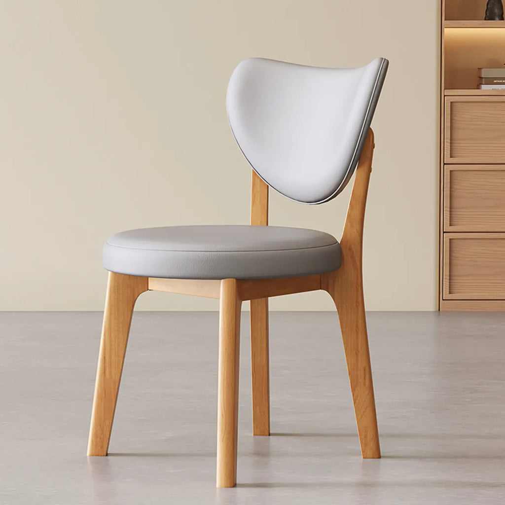 Chaise de salle à manger moderne sans accoudoirs, dossier enveloppant et revêtement en similicuir