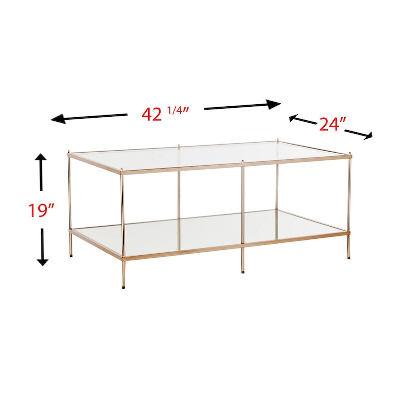 Rechthoekige salontafel van SEI Furniture Grant met goudkleurige afwerking, glazen bovenblad en onderste legplank