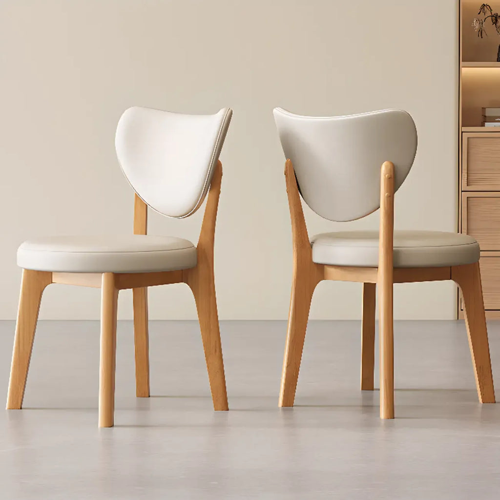 Chaise de salle à manger moderne sans accoudoirs, dossier enveloppant et revêtement en similicuir